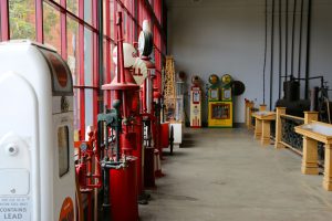 Assorted gas station pumps and other related tools lined up along the walls of the rig room in the California Oil Museum.