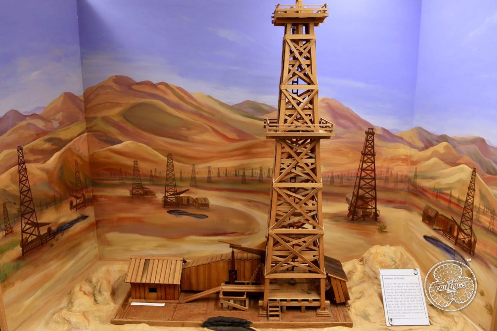 In the late 1920's there were over 7000 wooden derricks on the Westside of Kern County, both cable tool rigs, like the large model here, and rotary rigs. After drilling, the derricks were left standing over the well for production purposes. With the advent of the portable well pullers, and portable drilling rigs, the old wooden derricks were no longer necessary, and so in the late 1950s and 60's all the wooden derricks were thrown (town down). Our original derrick on the Museum grounds, standing over its original hole, is the last of its kind.